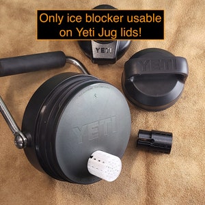 May include: Black Yeti Jug lid with a stainless steel handle and a white ice blocker. The lid has the Yeti logo on it. The text "Only ice blocker usable on Yeti Jug lids!" is written in orange on a black background.