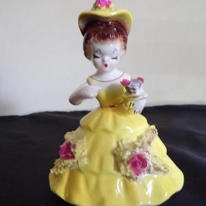 Vintage Ceramic European Child in a Victorian Yellow Dress Adoring Red Roses and Spaghetti Trim 5&#39; Tall x 3 1/2&quot;, by Arnant