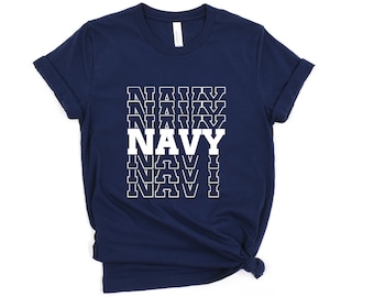 May include: Navy blue t-shirt with a white graphic of the word "NAVY" repeated in a stacked pattern.