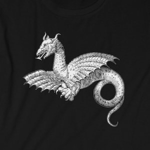 May include: Black t-shirt with a white graphic print of a winged sea serpent with a curled tail.