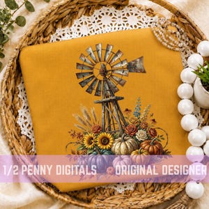 May include: A mustard yellow fabric square featuring a graphic print of a rustic metal windmill surrounded by a harvest arrangement of orange and white pumpkins, sunflowers, wheat stalks, and various autumn flowers with green foliage.