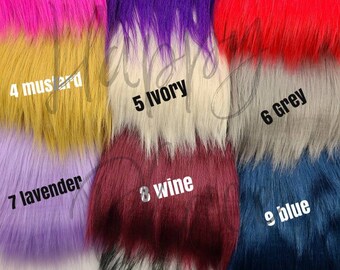 May include: Twelve different colors of faux fur fabric swatches. The colors are pink, purple, red, mustard, ivory, grey, lavender, wine, blue, white, black with white tips, and black.