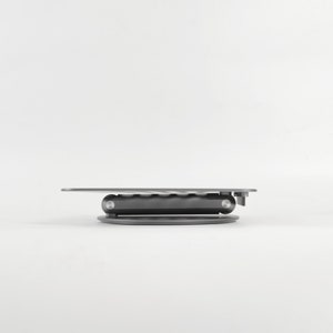 A folded laptop stand is displayed on the side against a white background.