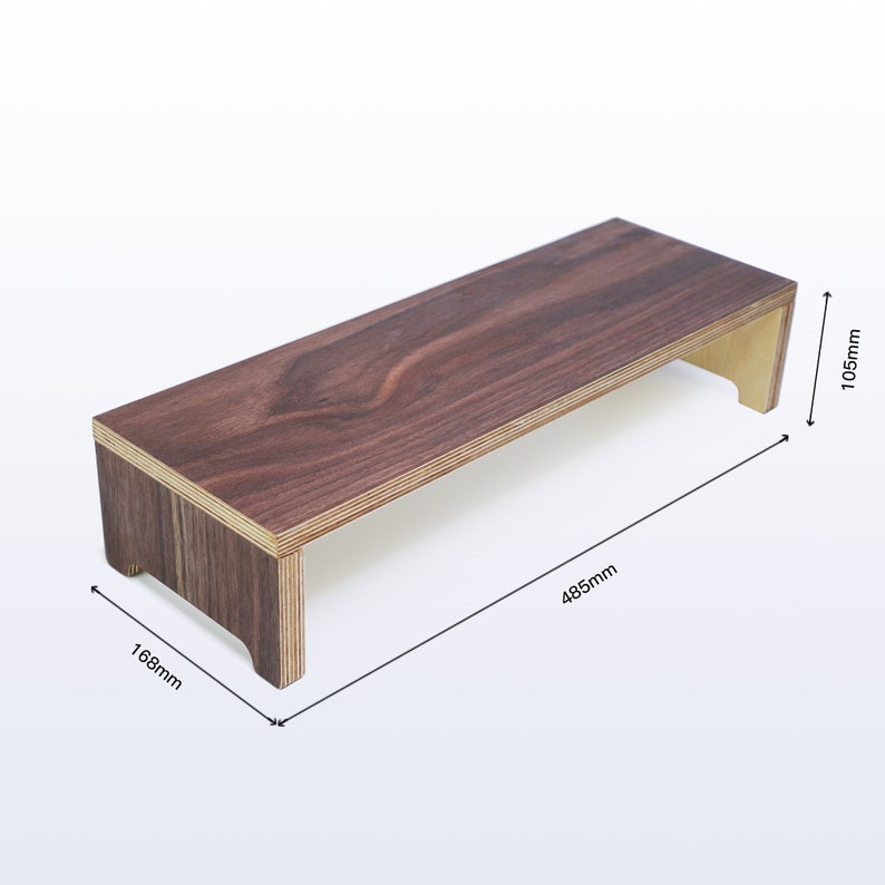 May include: A wooden riser with a dark brown finish and a light wood base. The riser measures 16.8 inches wide, 19.1 inches long, and 4.1 inches high.