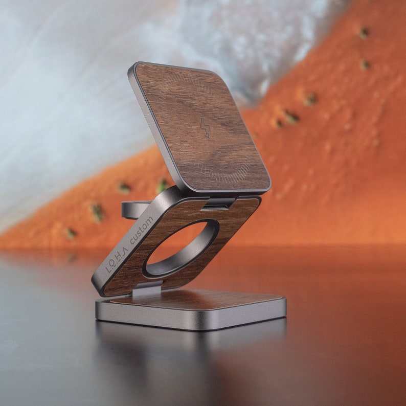 A 3 in 1 folding charger with a unfolded wooden surface is placed on the desktop.