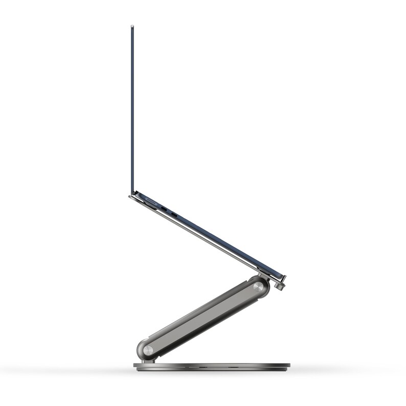 A laptop stands on a 90-degree display against a white background.