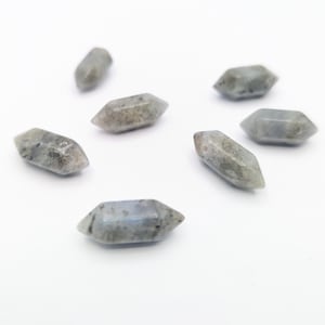 May include: Six grey and white labradorite crystal points, each with a unique shape and pattern.