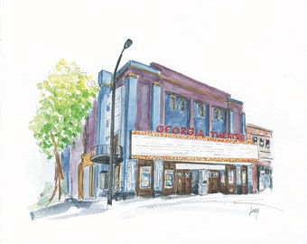 Könnte beinhalten: Ein Aquarellbild eines Gebäudes mit einem Schild, auf dem "Georgia Theatre" steht. Das Gebäude ist in Blautönen, Lila und Braun gemalt. Vor dem Gebäude befindet sich eine Straßenlaterne und links ein Baum.