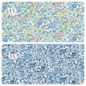 May include: Two fabric swatches with floral patterns. Swatch 13 features a white background with small blue, pink, and yellow flowers and green leaves. Swatch 14 displays a dense pattern of various shades of blue flowers and leaves on a white background.
