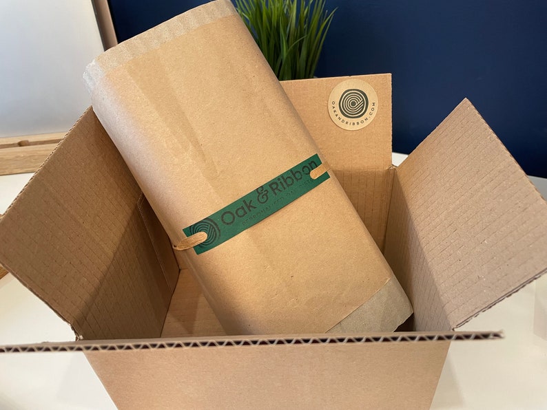 Proud to show our eco friendly brand packaging. How your order will arrive.  Outer cardboard box, item wrapped in recycled corrugated cardboard, then a layer of kraft paper tied together with raffia ribbon with our handmade Oak & Ribbon green label.