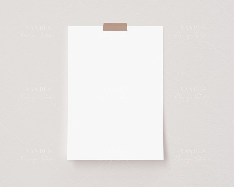 May include: A blank white sheet of paper taped to a light gray wall. The paper is square shaped and has a brown tape strip at the top.
