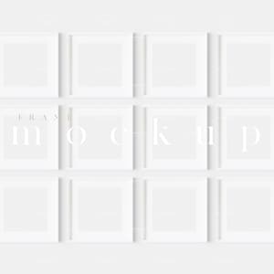 May include: A white wall with nine white square picture frames arranged in a 3x3 grid. The frames are all the same size and have a simple, modern design.