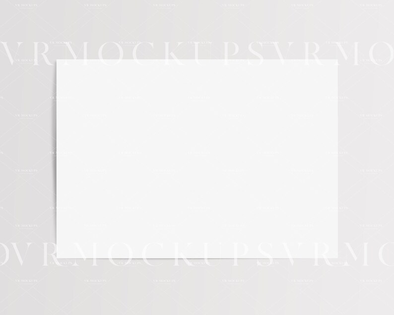 Puede incluir: Una tarjeta blanca en blanco sobre un fondo gris claro.