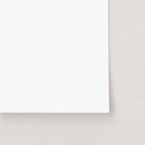 May include: A blank white card on a light gray textured background.