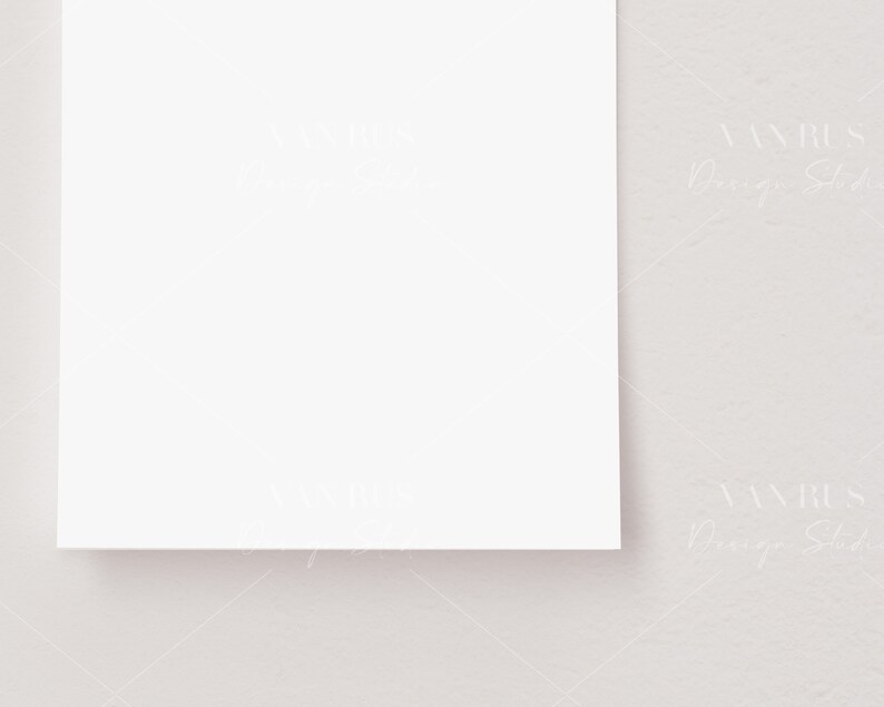 May include: A blank white card on a light gray textured background.