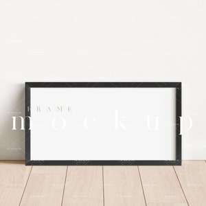 May include: A black frame mockup with a white background. The frame is on a light wood floor.