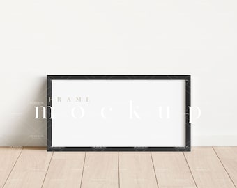 May include: A black frame mockup with a white background. The frame is on a light wood floor.