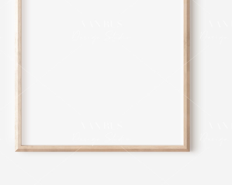 May include: A simple, light wood picture frame with a white background.