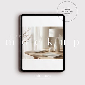 May include: iPad mockup featuring a minimalist design. The screen shows a calm interior scene with a lamp, books, and decorative items on a wooden table. The words "iPad Mockup" and "Change Background Color" are visible.