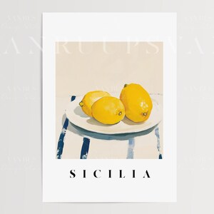 May include: Three yellow lemons on a white plate with a blue and white striped tablecloth. The text "SICILIA" is printed below the plate.