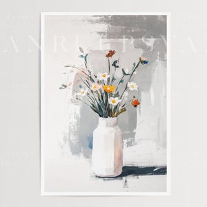 May include: A white ceramic vase with a bouquet of white, yellow, and red flowers. The vase is sitting on a white surface with a gray and white abstract background.