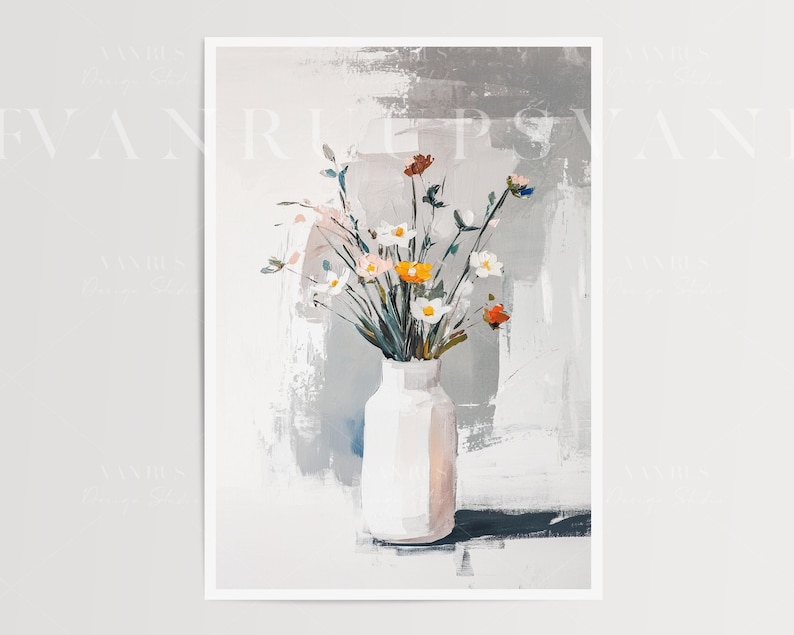 May include: A white ceramic vase with a bouquet of white, yellow, and red flowers. The vase is sitting on a white surface with a gray and white abstract background.