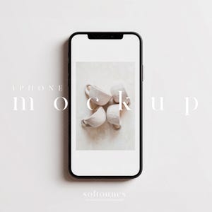 May include: A black smartphone mockup with a white screen displaying a photo of four small, off-white ceramic cups. The word "mockup" is written on the screen. The text "iPhone" and "softounes" are also visible.