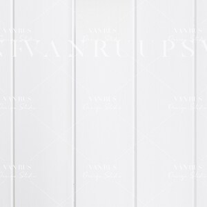 May include: White painted wood panelling with vertical planks. The wood is smooth and has a subtle texture.