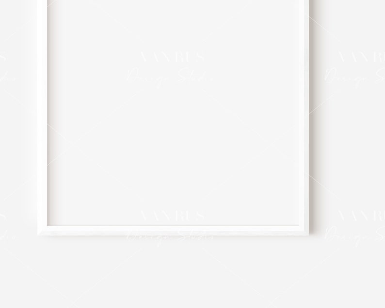 May include: A white picture frame with a white mat, hanging on a white wall.