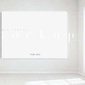 Puede incluir: Una maqueta de lienzo blanco en una habitación blanca con una ventana. El lienzo está en blanco y listo para tu diseño. El texto "LARGE CANVAS MOCKUP PSD.JPG" está impreso en el lienzo.