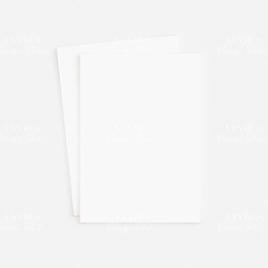 May include: Two blank white cards stacked on top of each other on a white background.