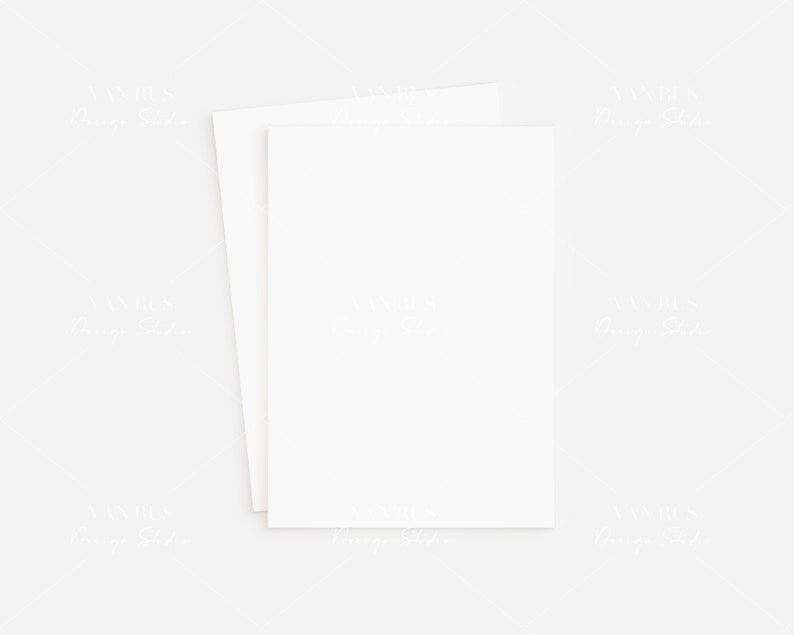 May include: Two blank white cards stacked on top of each other on a white background.