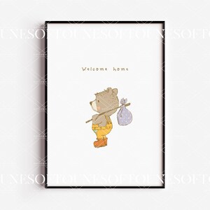 May include: A framed print with a cute cartoon bear carrying a small bag and a stick. The text "Welcome home" is written above the bear.