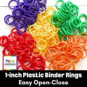 May include: A collection of 1-inch plastic binder rings in various colors: purple, yellow, green, red, and orange. The rings are easy to open and close, ideal for organizing papers or projects. The image includes the text "All Hands On Language" and "1-inch Plastic Binder Rings Easy Open-Close."