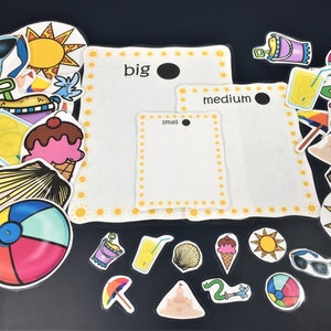 May include: A set of colourful summer-themed stickers with different sizes, including a beach ball, ice cream cone, seashell, and a sun. The stickers are arranged around three white cards with the words "big", "medium", and "small" printed on them.