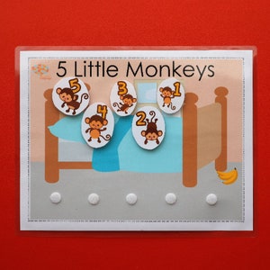 May include: A learning game for kids featuring five monkeys on a bed with numbers 1 through 5. The game is designed to help children learn to count.