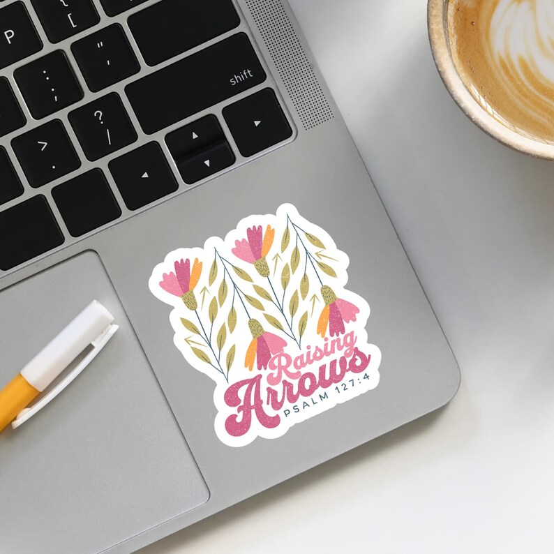 May include: A sticker with a floral design and the text "Raising Arrows" with the Bible verse "Psalm 127:4" underneath.