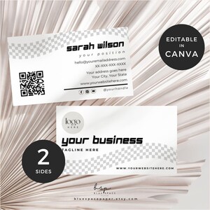 May include: Two-sided business card design with a white background and a checkered pattern. The front features contact information, a QR code, and social media icons. The back has space for a logo and tagline. The design is labelled "Editable in Canva."