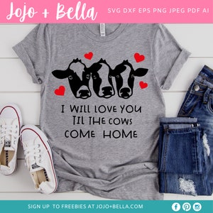 May include: A gray t-shirt with the text "I WILL LOVE YOU TIL THE COWS COME HOME". The shirt features a graphic of three cow faces and red hearts. White sneakers and blue jeans are also visible.