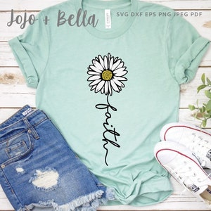May include: A light blue t-shirt with a white daisy and the word "faith" written in a cursive font.