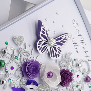 May include: A handmade card with a purple butterfly, flowers, and silver glitter. The card says "To A Wonderful Mum".