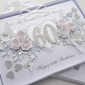 May include: A handmade 60th birthday card in a white box. The card features silver glitter numbers, paper roses, butterflies, and hearts. Text includes "To My Beautiful Daughter Beverly" and "Happy 60th Birthday".