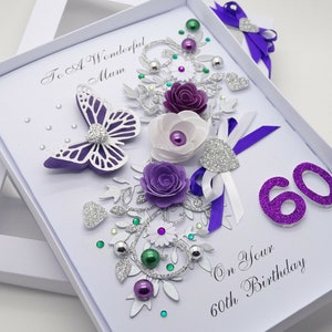 May include: Purple and white handmade birthday card with a butterfly, flowers, glitter, and the text "To A Wonderful Mum On Your 60th Birthday".