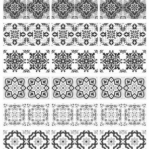 May include: A selection of decorative tiles featuring detailed floral and geometric patterns in grey and white. The tiles are arranged in rows, displaying various designs suitable for home decor and design projects.
