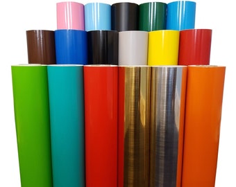 May include: Assortment of vinyl rolls in various colours, including green, turquoise, red, gold, silver, and orange. The rolls are arranged in a pyramid shape, with the top row containing pink, light blue, black, green, and blue rolls.