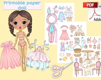 May include: Printable paper doll with a variety of outfits and accessories, including a bunny costume, dresses, and a basket. The doll has brown hair and blue eyes. The image also includes a pair of scissors and the text "Printable paper doll".