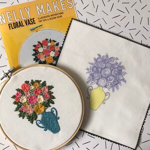 May include: A close-up of a completed embroidery project of a floral vase with pink, yellow, and white flowers in a teal blue vase. The embroidery is in a wooden embroidery hoop. The image also shows a printed pattern for the embroidery project, which is titled "Nelly Makes Floral Vase" with illustrated instructions and design tips.