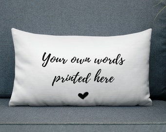 May include: White pillow with black text that reads "Your own words printed here" and a small black heart.
