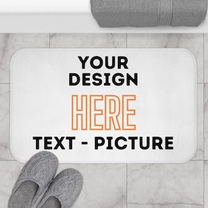 May include: White bath mat with black text that says "YOUR DESIGN HERE TEXT - PICTURE".