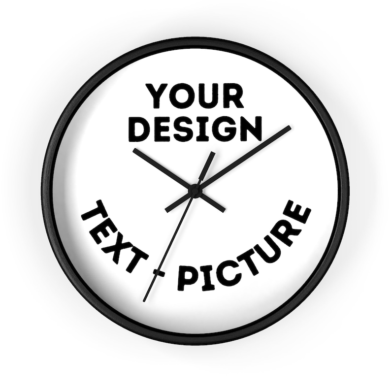 May include: A black and white clock with a black frame. The clock face has the text "YOUR DESIGN" at the top, "TEXT" at the bottom left, and "PICTURE" at the bottom right.
